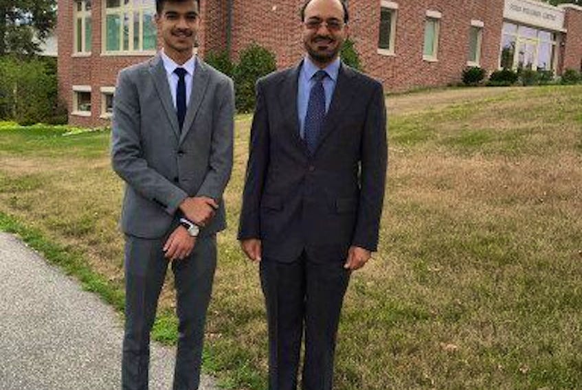 Former Saudi intelligence official Saad al-Jabri (R) poses with his son Omar al-Jabri whilst visiting schools around Boston, U.S.