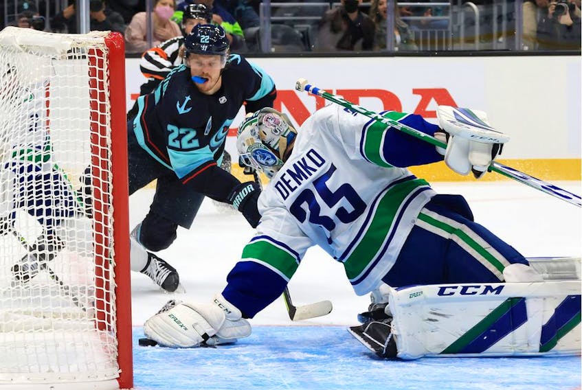  Thatcher Demko of the Vancouver Canucks makes the save against the Seattle Kraken during the Kraken’s inaugural home-opener Oct. 23 at Climate Pledge Arena.