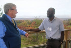 Dr. Jerry Asiedu, right, speaks with Don Hyslop after the first Mid Valley Region Physician Recruitment and Retention Committee community welcome event Oct. 23 in Bridgetown. Hyslop is the committee lead for newly formed group.