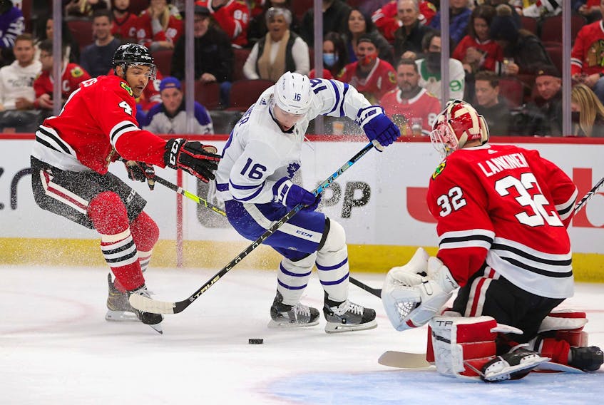Maple Leafs' Mitch Marner tries to get off a shot against Kevin Lankinen of the Blackhawks under pressure from Seth Jones at the United Center on Wednesday, Oct. 27, 2021 in Chicago.