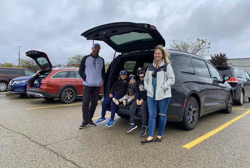 Veronica Jenik (right) and husband Dan (left) are the parents of two hockey and baseball rep players and their trusty Chrysler Pacifica (nicknamed Darth Vader) has room for all the gear and the kids to travel in sinister style. Jonathan Yarkony/Postmedia News