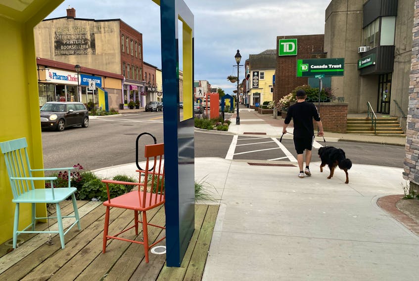 Walking a dog in downtown Yarmouth. A motion that came to the Town of Yarmouth's Committee of the Whole meeting on Oct. 28 to explore perhaps making the central business a dog-free zone went nowhere. TINA COMEAU • TRICOUNTY VANGUARD