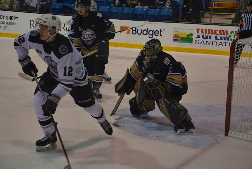 Charlottetown Islanders goaltender Jacob Goobie tracks the puck during the first period of a Quebec Major Junior Hockey League game against the Gatineau Olympiques at Eastlink Centre on Oct. 28. Tristan Allard, 12, of the Olympiques and Islanders defenceman Oscar Plandowski, 7, position themselves for a possible rebound. 