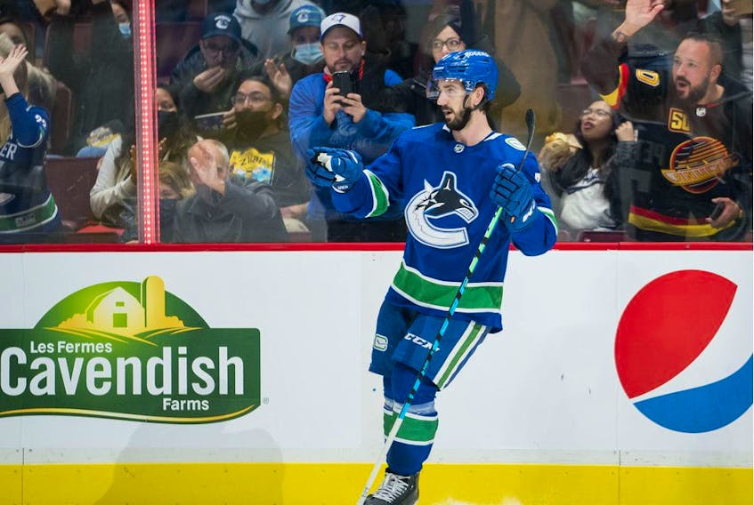 Vancouver Canucks forward Nic Petan (7) celebrates his goal against  the Winnipeg Jets in the second period at Rogers Arena, Oct. 3, 2021.