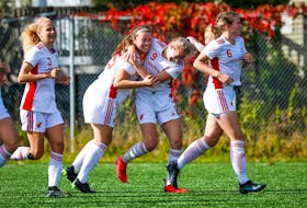 Nicole Torraville hugs teammate Holly O'Neill after the Memorial Sea-Hawks' 3-1 win over the UNB Reds in AUS women's soccer play Saturday at King George V Park in St. John's. O'Neill, who scored twice in the game, also had the Sea-Hawks' lone goal in a 1-0 victory Sunday that completed a sweep of the Reds. — Memorial Athletics/Facebook