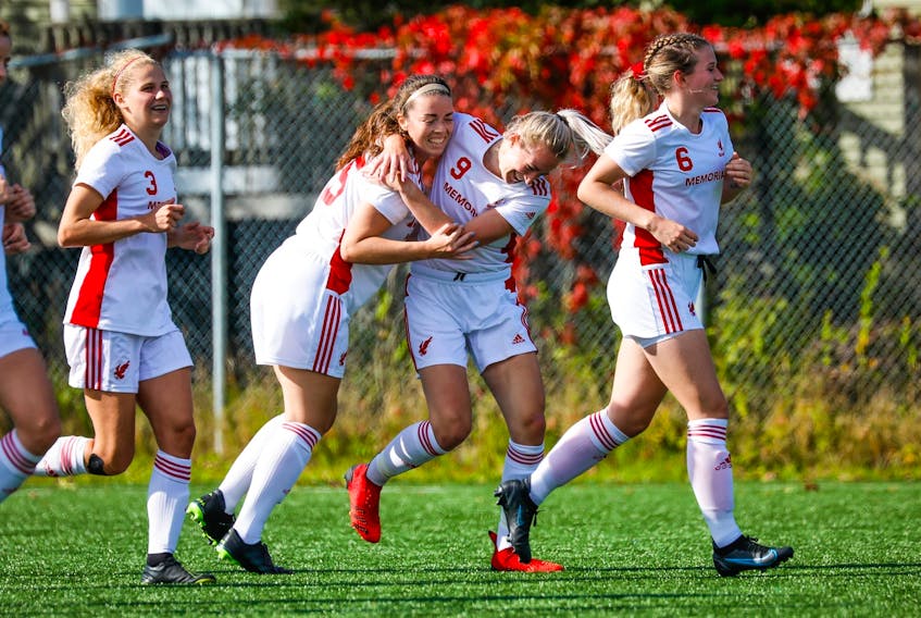 Nicole Torraville hugs teammate Holly O'Neill after the Memorial Sea-Hawks' 3-1 win over the UNB Reds in AUS women's soccer play Saturday at King George V Park in St. John's. O'Neill, who scored twice in the game, also had the Sea-Hawks' lone goal in a 1-0 victory Sunday that completed a sweep of the Reds. — Memorial Athletics/Facebook