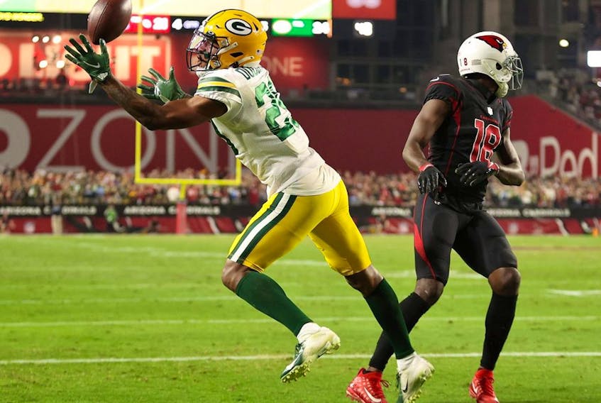 Rasul Douglas of the Green Bay Packers intercepts a pass intended for A.J. Green of the Arizona Cardinals during the fourth quarter of a game at State Farm Stadium on Oct. 28, 2021 in Glendale, Arizona. The Packers defeated the Cardinals 24-21.
