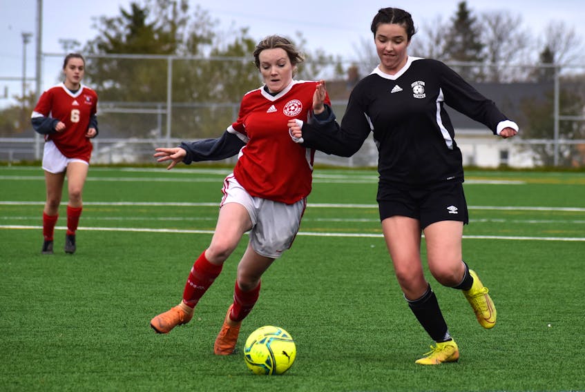 Hailey Dwyer-Parsons of the Riverview Ravens, left, battles with Annaya Zwicker of the Horton Griffins during School Sport Nova Scotia junior varsity girls' provincial championship action at MacKinnon Memorial Field in New Waterford, Friday. Horton won the game 3-2. JEREMY FRASER/CAPE BRETON POST.
