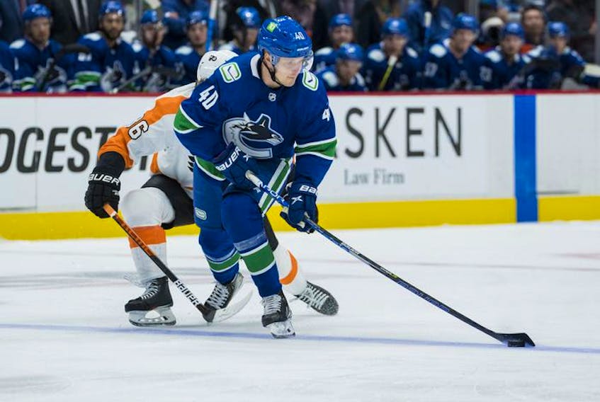  Vancouver Canucks forward Elias Pettersson (40) moves the puck against the Philadelphia Flyers in the third period at Rogers Arena on Thursday. Flyers won 2-1.