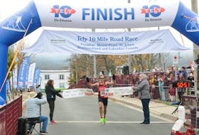 Colin Fewer won the male division of the 2021 Tely 10, 10-Mile Road race Sunday morning, Oct. 31, crossing the finish line at Bannerman Park with a time of 50:52.
-Joe Gibbons/The Telegram
