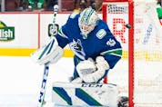 Vancouver Canucks goalie Thatcher Demko makes a save against the Edmonton Oilers during first period NHL hockey action in Vancouver on Saturday, Oct. 30, 2021.