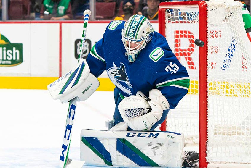  Vancouver Canucks goalie Thatcher Demko makes a save against the Edmonton Oilers during first period NHL hockey action in Vancouver on Saturday, Oct. 30, 2021.