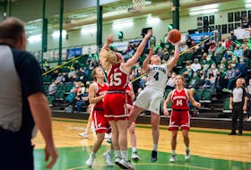 Jenna Mae Ellsworth, 4, of the UPEI Panthers drives to the basket while guarded by the Memorial Sea-Hawks’ Hannah Green during an Atlantic University Sport women’s basketball game at the Chi Wan Young Sport Centre in Charlottetown on Oct. 30. Ellsworth scored 15 points for the Panthers, who won the game 80-57. 