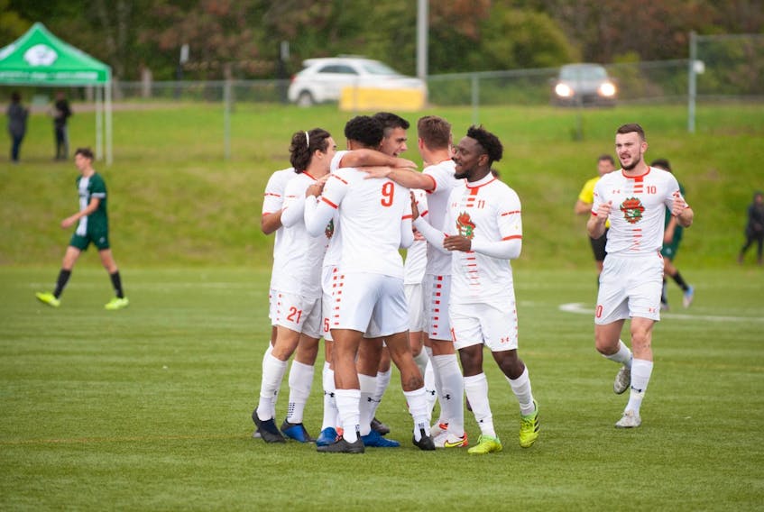The Cape Breton Capers men's soccer team celebrates a goal during Atlantic University Sport action against the Prince Edward Island Panthers at UPEI Turf Facilities in Charlottetown, Sunday. Cape Breton and UPEI tied 1-1. PHOTO CONTRIBUTED/THOMAS BECKER.