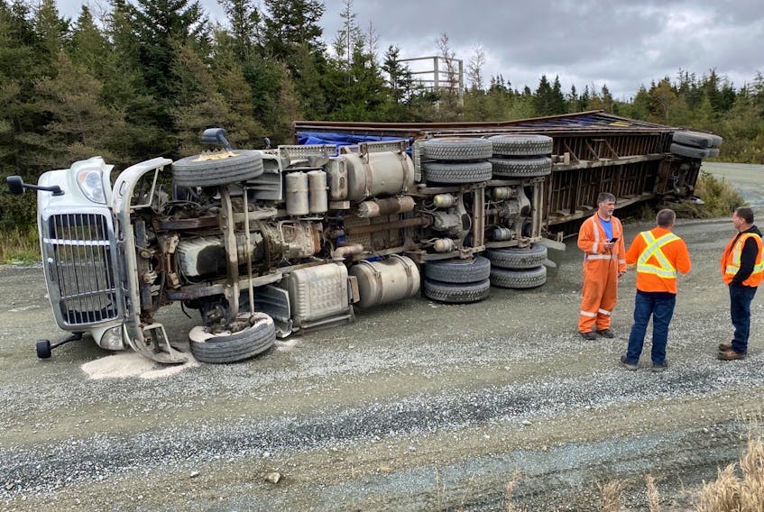 Hundreds of chickens were stuck in their cages when this truck overturned Monday morning, Oct. 4, 2021, near Cochrane Pond outside St. John's, N.L.