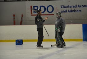 Drew MacIntyre chats with UPEI Panthers goaltender Sasha Weeks at the Pownal Sports Centre recently. MacIntyre recently began the role of development goaltending coach for the National Hockey League’s Winnipeg Jets organization.