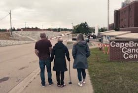 Left to right, Tim and Cayla Toomey along with daughter Haley, head into the Cape Breton Cancer Centre in Sydney where Cayla received treatment before her death on March 17, 2021. Contribute