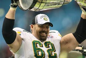 Port Hood product Bruce Beaton lifts the Grey Cup as a member of the Edmonton Eskimos. Beaton will be inducted into the Acadia Sports Hall of Fame next week in Wolfville. CONTRIBUTED