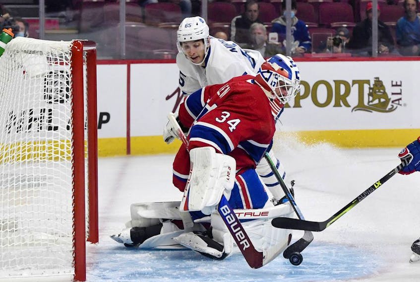 Canadiens' Jake Allen makes a save against Toronto Maple Leafs forward Ilya Mikheyev during first period at the Bell Centre on Sept. 27, 2021.