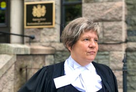 St. John's lawyer Lynn Moore speaks to reporters outside Newfoundland and Labrador Supreme Court Wednesday morning, Oct. 6.