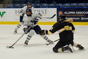 Maggy Burbidge of the St. Francis Xavier X-Women skates into the Dalhousie Tigers' zone during an AUS women's hockey exhibition game earlier this month. Burbidge joined St. F.X. after Robert Morris University in Pennsylvania axed its hockey programs in May. - BRYAN KENNEDY / ST. F.X. ATHLETICS