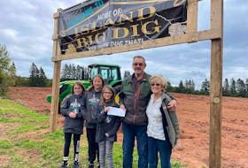 Levi Barnes and his wife, Peggy, right, hold a cheque for $10,000 they won in the Island Big Dig fundraiser on Oct. 2. The fundraiser was organized by the P.E.I. Smashers ringette league. Also pictured are, from left, Ali, Miley and Emily Heggie, daughters of one of the coaches and an organizer of the fundraiser.

