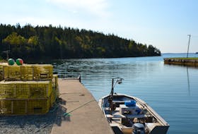 The small fishing boat belonging to a Potlotek lobster fisher sits idle on Thursday morning after the fishery's traps were seized by DFO overnight. Wednesday was the first day of the fall season for the community's  moderate livelihood fishery. ARDELLE REYNOLDS/CAPE BRETON POST