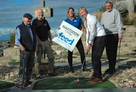 Nova Scotia Premier Tim Houston lines up his putt to kick-off a weekend of golf proceeds, at Mastodon Ridge Mini-Golf course, going towards area food banks. Pictured along with Houston are Mastodon Ridge owner Bill Hay (left), Mayor of Stewiacke George Lloy, director of communications with Feed Nova Scotia Karen Theriault, and Colchester-Musquodoboit Valley MLA Larry Harrison.