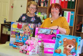 Diane Parlee, left, and Wanda Earhart of the Every Women Centre stand in the back storage area of the facility, where toys and other gifts donated for their annual Adopt-a-Family Christmas campaign are stored. Registration for families starts Oct. 12. NICOLE SULLIVAN/CAPE BRETON POST 
