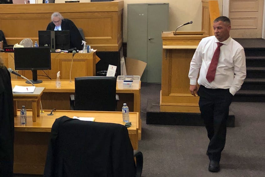 St. John's firefighter George Pottle leaves the witness stand at Newfoundland and Labrador Supreme Court in St. John's Friday afternoon, Oct. 8, having testified as the last witness at his assault trial. Pottle is accused of assaulting his ex-girlfriend in April 2018.
