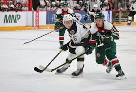 Halifax Mooseheads forward Zach Beauregard, right, and Charlottetown Islanders forward Patrick Guay battle during Saturday's QMJHL game at the Scotiabank Centre.