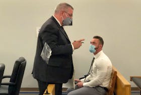 Noel Strapp (right) speaks with his lawyer Ian Patey during a break in his sexual assault, sexual exploitation trial at N.L. provincial court in St. John's.
