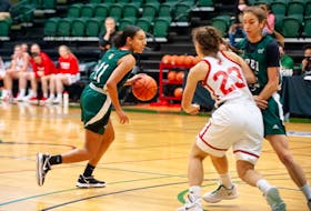 The UPEI Panthers’ Lauren Rainford, 11, controls the ball during an Atlantic University Sport women’s basketball game against the Memorial Sea-Hawks in Charlottetown on Oct. 31. Rainford scored a game-high 27 points in leading the Panthers to a 71-57 victory. 