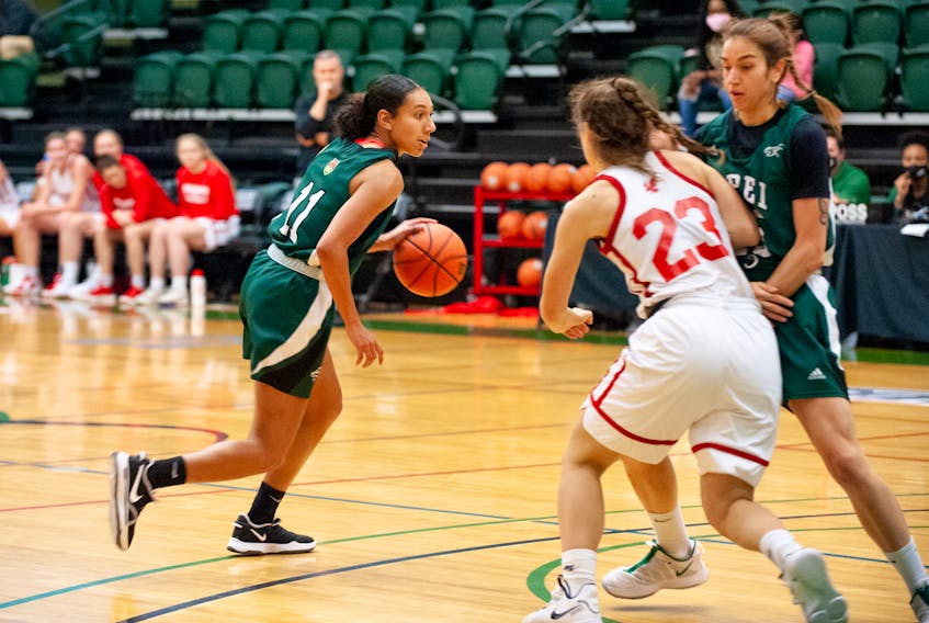 The UPEI Panthers’ Lauren Rainford, 11, controls the ball during an Atlantic University Sport women’s basketball game against the Memorial Sea-Hawks in Charlottetown on Oct. 31. Rainford scored a game-high 27 points in leading the Panthers to a 71-57 victory. 