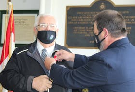 The George R. Pearkes V.C. Branch #5 Royal Canadian Legion in Summerside kicked off the local poppy campaign the morning of Oct. 29. Legion president Gordon Perry, right, began the campaign by pinning a poppy to Mayor Basil Stewart at 11 a.m. at the legion.