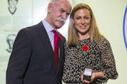  Lanny McDonald, Chairman of the Hockey Hall of Fame, presents the ring to 2018 Hockey Hall of Fame inductee Jayna Hefford, during a presentation at the Hockey Hall of Fame in Toronto, Ont. on Friday November 9, 2018.