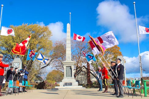 The colour guard stands at the Royal Canadian Legion cenotaph outside the Armstrong Memorial branch 19 in North Sydney during the Remembrance Day ceremony on Thursday. More than 300 people attended the service. Chris Connors/Cape Breton Post