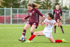 The Holland Hurricanes’ Renee Arsenault, 20, makes a pass as the Fanshawe Falcons’ Sophia Matus, 17, slides to break up the play. The two teams met in a bronze-medal quarter-final game at the Canadian Collegiate Athletic Association (CCAA) women’s soccer championship in Vaughan, Ont., on Nov. 11. The Falcons won the game 2-0. 