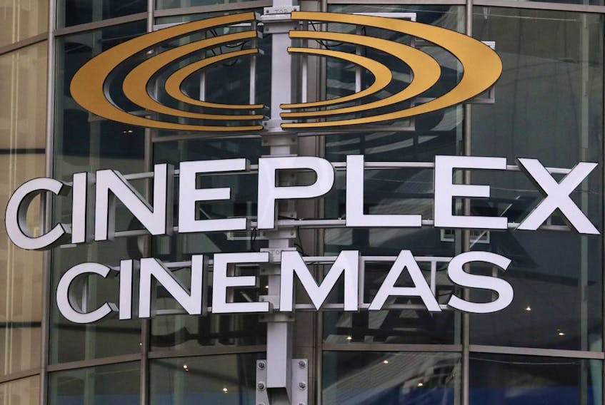 A Cineplex movie theatre sign looms over Yonge street in Toronto on March 16, 2020.  