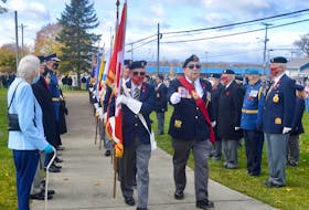 Ashby Legion sergeant-at-arms Dave Piercy, centre right, marches the traditional honour guard led by legion second vice president Brian Greoge, to start the Remembrance Day ceremony at the Ashby Corner cenotaph. DAVID JALA/CAPE BRETON POST
