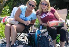 Jennifer Hillier Penney and her daughter, Marina, sitting together at the beach in better times. Next month will mark five years since Jennifer's disappearance, and Marina is seeking justice for her mother, whom she believes was abducted and murdered.