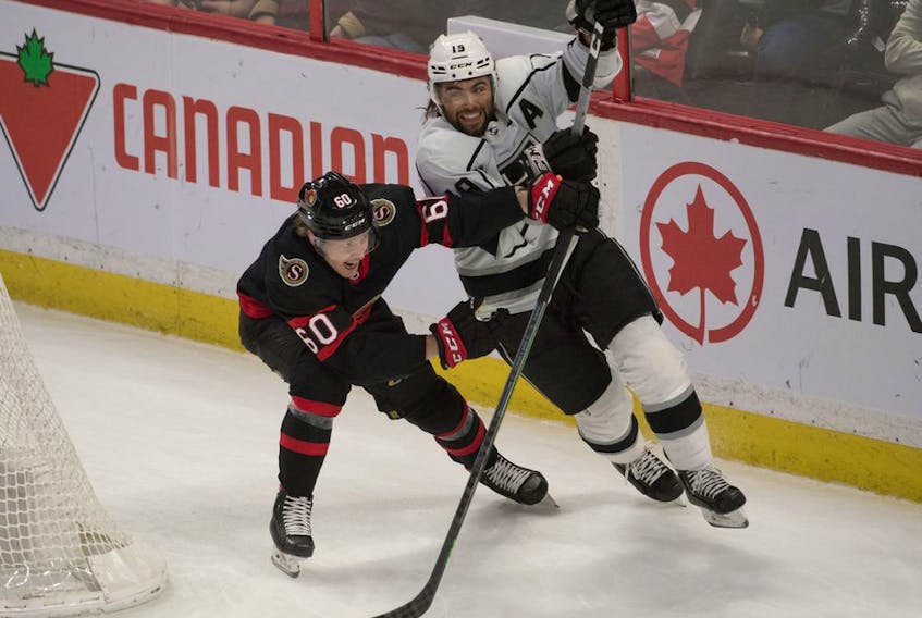 Ottawa Senators defenceman Lassi Thomson (60) battles with Los Angeles Kings left wing Alex Lafalio (19) in the third period at the Canadian Tire Centre, Nov. 11, 2021.