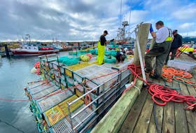 Lobster vessels were loaded with traps and gear at the wharf in Pinkney’s Point, Yarmouth County, on Nov. 28, 2020. The season that was to have started two days later in LFA 34 did not get underway until Dec. 8 due to strong winds and poor weather. The bright spot of the season, however, was a strong shore price throughout the season. TINA COMEAU PHOTO