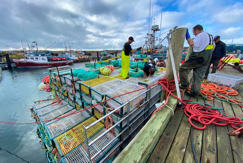 Lobster vessels were loaded with traps and gear at the wharf in Pinkney’s Point, Yarmouth County, on Nov. 28, 2020. The season that was to have started two days later in LFA 34 did not get underway until Dec. 8 due to strong winds and poor weather. The bright spot of the season, however, was a strong shore price throughout the season. TINA COMEAU PHOTO