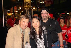 Kevin Segal (right) and his wife Marivic (centre) are shown here with Detroit Red Wings legend Ted Lindsay during a vacation in 2011. Often, the couple will plan their family vacations to coincide with a sports team that Kevin wants to see.