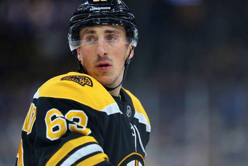  Brad Marchand #63 of the Boston Bruins looks on during the first period of the game against the Calgary Flames at TD Garden on February 25, 2020 in Boston, Massachusetts.