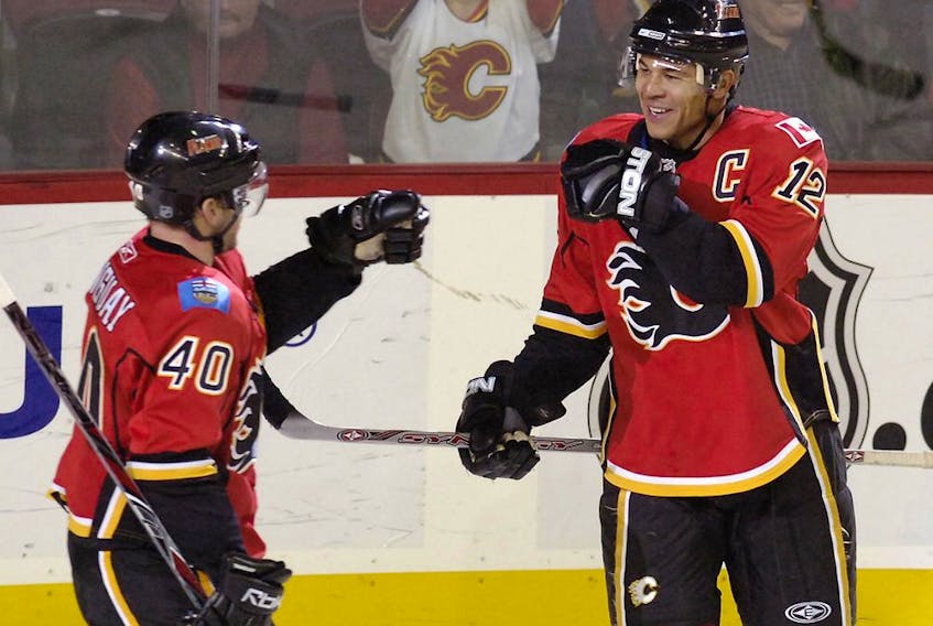  Calgary Flames Jarome Iginla (R) celebrates with Alex Tanguay after he scores the fifth goal of the game against the Nashville Predators in 3rd period NHL action at the Pengrowth Saddledome in Calgary.