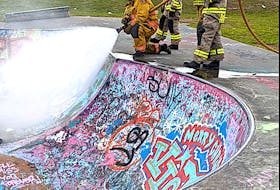 Members of the Coxheath Volunteer Fire Department extinguish a tire fire at the Island Skateboard Park in Coxheath earlier this month. Chief Bill MacLeod is concerned the vandalism will lead to someone getting hurt or killed. Contributed 
