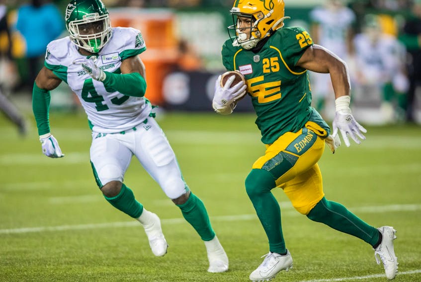 Saskatchewan Roughriders' Deon Lacey (45) chases Edmonton Elks' Walter Fletcher (25) during first half CFL action in Edmonton on Friday, November 5, 2021.  The Elks lost 29-24 to the Roughriders in Regina, Sask.,on Saturday.