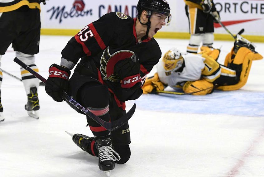 Senators forward Parker Kelly celebrates his second-period goal against the Penguins on Saturday night.